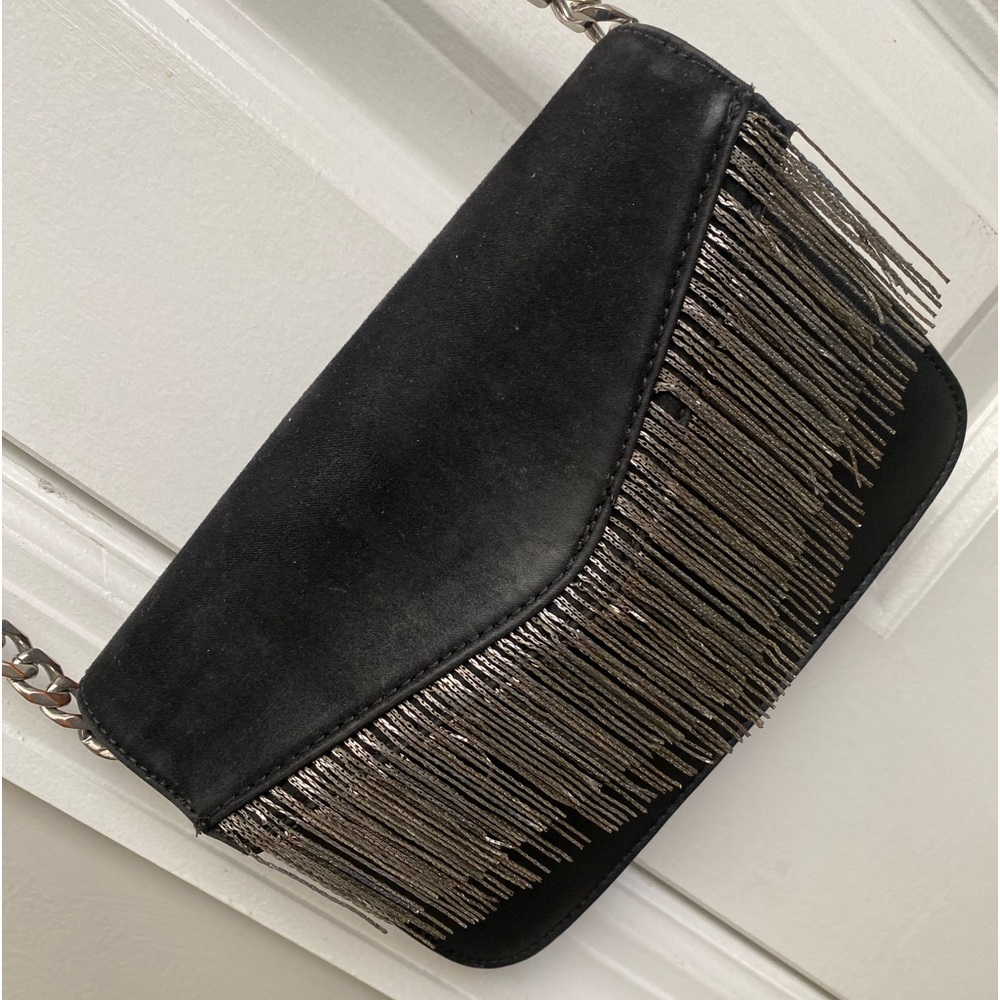 TopShop purse in color black with silver finge. Silver and black strap.